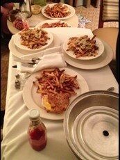 Room service with grilled cheese sandwiches and French fries