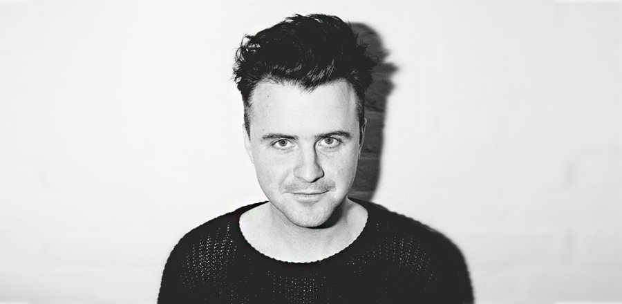A black and white photo of songwriter, Alex Burnett