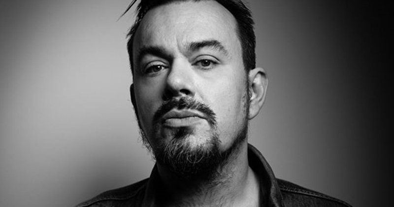 Black and white photo of producer and manager Tom Larkin